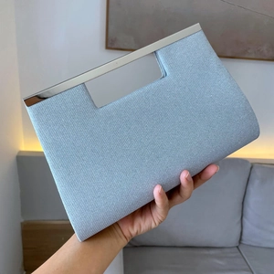 Elegant silver glitter evening clutch with metal top handle for formal occasions and parties