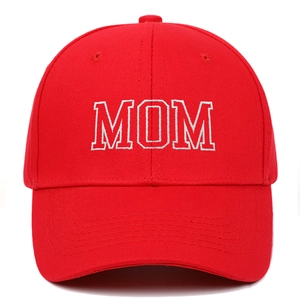 Detailed embroidery of white MOM letters on a bright red cotton baseball cap