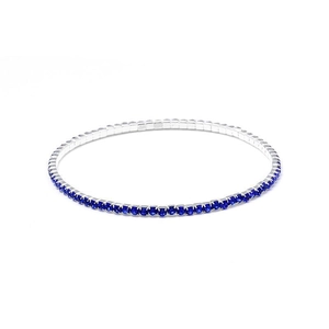 Macro detail of 2mm silver stretch bracelet featuring square-cut blue crystal rhinestones