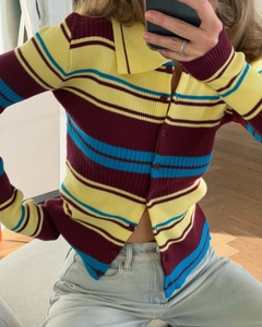 Detail of slim fit ribbed knit cardigan with colorful stripes and polo collar