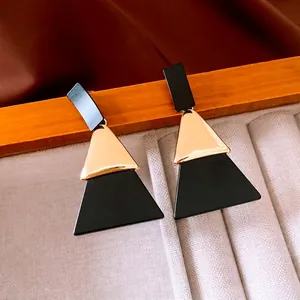 Elegant geometric black and gold acrylic triangle dangle earrings with silver needle post