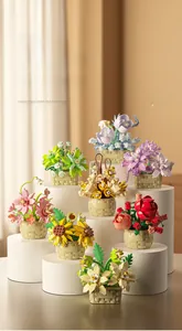 Detail of building block flower baskets featuring roses and sunflowers on pedestals