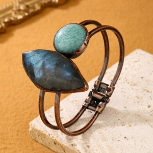 Vintage bronze bangle featuring natural labradorite and amazonite stones in a rustic setting
