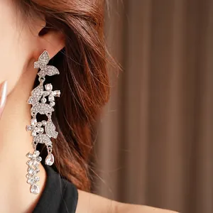 Sparkling butterfly tassel earrings for women with silver pins and crystal drop pendants