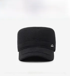 Front view of black flat top military cap with textured fabric and metal peak logo