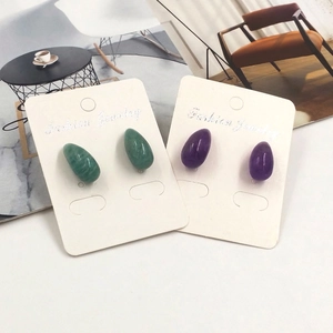 Waterdrop natural stone stud earrings set in amethyst and green aventurine on display card