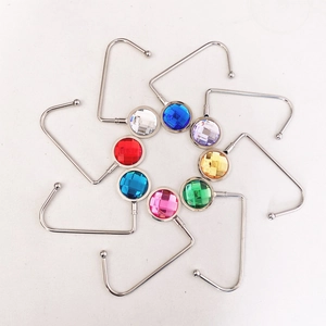 Portable metal bag hooks with colorful crystal diamonds for tables in a circular display