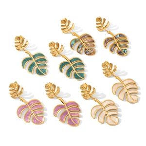 Golden monstera leaf earrings with colorful enamel inlay in tropical island style