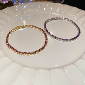Elegant adjustable zircon bracelet in gold and silver finish with purple gemstones