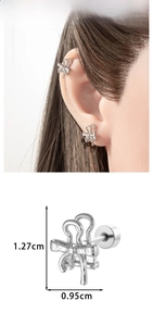 Polished silver bow stud earring detail with dimensions 1.27cm height and 0.95cm width