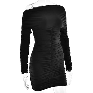 Detailed view of black ruched fabric on a slim fit long sleeve off-shoulder dress