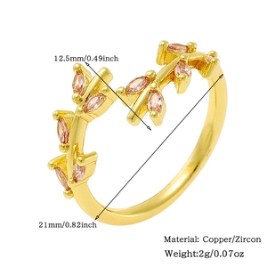 Detail of copper zircon ring featuring pink stone leaf design and size dimensions