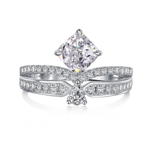 Macro shot of S925 sterling silver ring featuring a radiant square cut diamond and pear drop