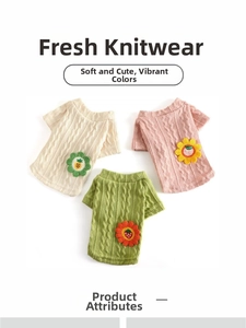 Detailed cable knit pattern on pet sweaters with decorative fruit and flower patches