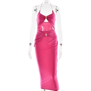 Detail of rose pink dress with halter gold chain neckline and wave metal buckle