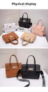 Close-up of quilted PU leather handbag with metallic turn-lock and patterned wide strap