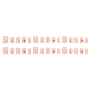 Short square press-on nails in nude pink with red heart patterns and colorful dots