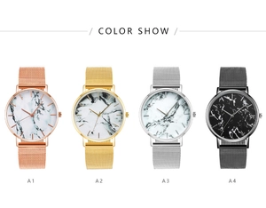 Various quartz watches with marble dials and mesh straps in gold, silver, and black