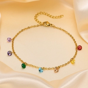 18K gold plated stainless steel anklet with colorful rainbow gemstones on silk background