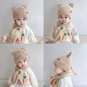 Detailed view of baby knitted hat with 3D ears and matching carrot scarf set in khaki color