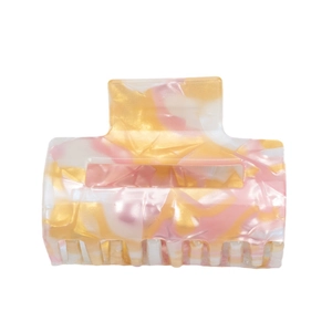 Pink and gold marble pattern square PVC hair claw clip with glossy finish on white backdrop
