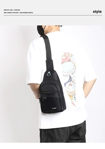 Detailed view of black nylon crossbody chest bag with multiple zipper compartments on model