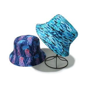 Detail of sun hats with jellyfish and shark prints on professional display stands