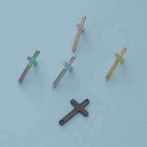Detailed view of 11x18mm stainless steel cross pendants in five assorted mirror finishes