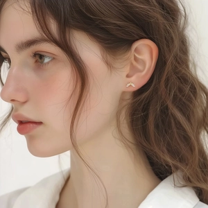 Elegant gold S925 sterling silver geometric zircon stud earrings on a female model