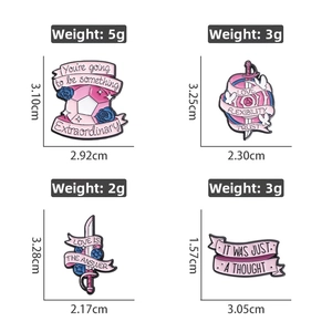 Detail of four colorful enamel lapel pins with swords and inspiring English words