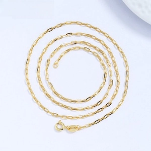 Detailed top view of a gold-plated S925 sterling silver cable chain necklace on blue background