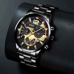 Macro shot of DEYROS black stainless steel sports watch with gold-tone chronograph dials