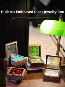 Walnut wood jewelry box with vintage embossed glass lid and colorful velvet interior