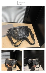 Close-up of black crossbody waist bag featuring skull print, silver chain, and large ring zipper
