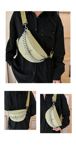 Detail of lime green half-moon chest bag with star studs and chunky silver metal chain