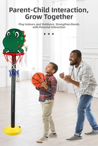 Father and son playing with an adjustable green dinosaur basketball hoop for kids indoors