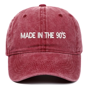 Detail of white 3D embroidery Made in the 90's on washed red vintage baseball cap