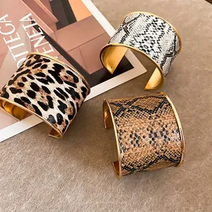 Golden wide open cuff bracelets with leopard and snake print animal patterns