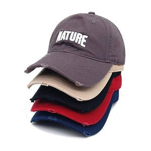 Distressed cotton baseball cap with NATURE embroidery in multiple vintage colors