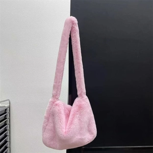 Close-up of pink faux rabbit fur texture and shoulder strap on a Y2K plush crossbody bag