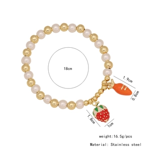 Detailed view of beaded bracelet featuring strawberry and carrot charms with size dimensions