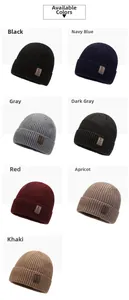 Detailed flat lay of knitted beanies in seven various colors including navy and grey