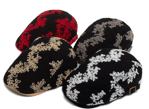 Detailed embroidery view of cotton jacquard beret hats in four retro colors with metal buckle