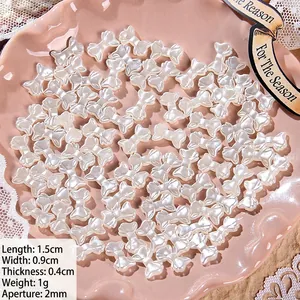Detailed view of white pearl luster bow beads with dimensions and hole size for DIY jewelry