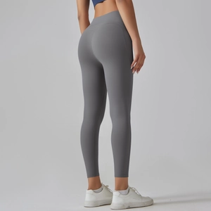 Rear view of high-waisted dark grey seamless yoga leggings with V-shaped butt lift detail