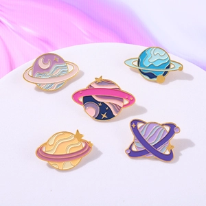5-piece planet enamel pin set with pink moon and stars on purple silk background