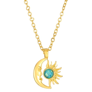 Golden sun and moon necklace with blue opal stone inlay on a minimalist chain