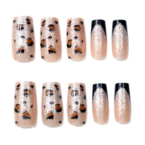 French leopard print press-on nails with silver glitter and black tip details