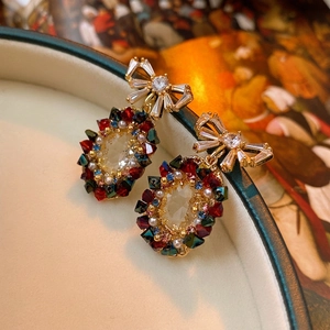 Vintage bow earrings with colorful zircon crystals and oval pearls in luxury style