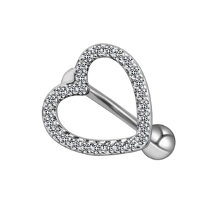 Macro shot of silver heart belly button ring with sparkling inlaid clear rhinestones